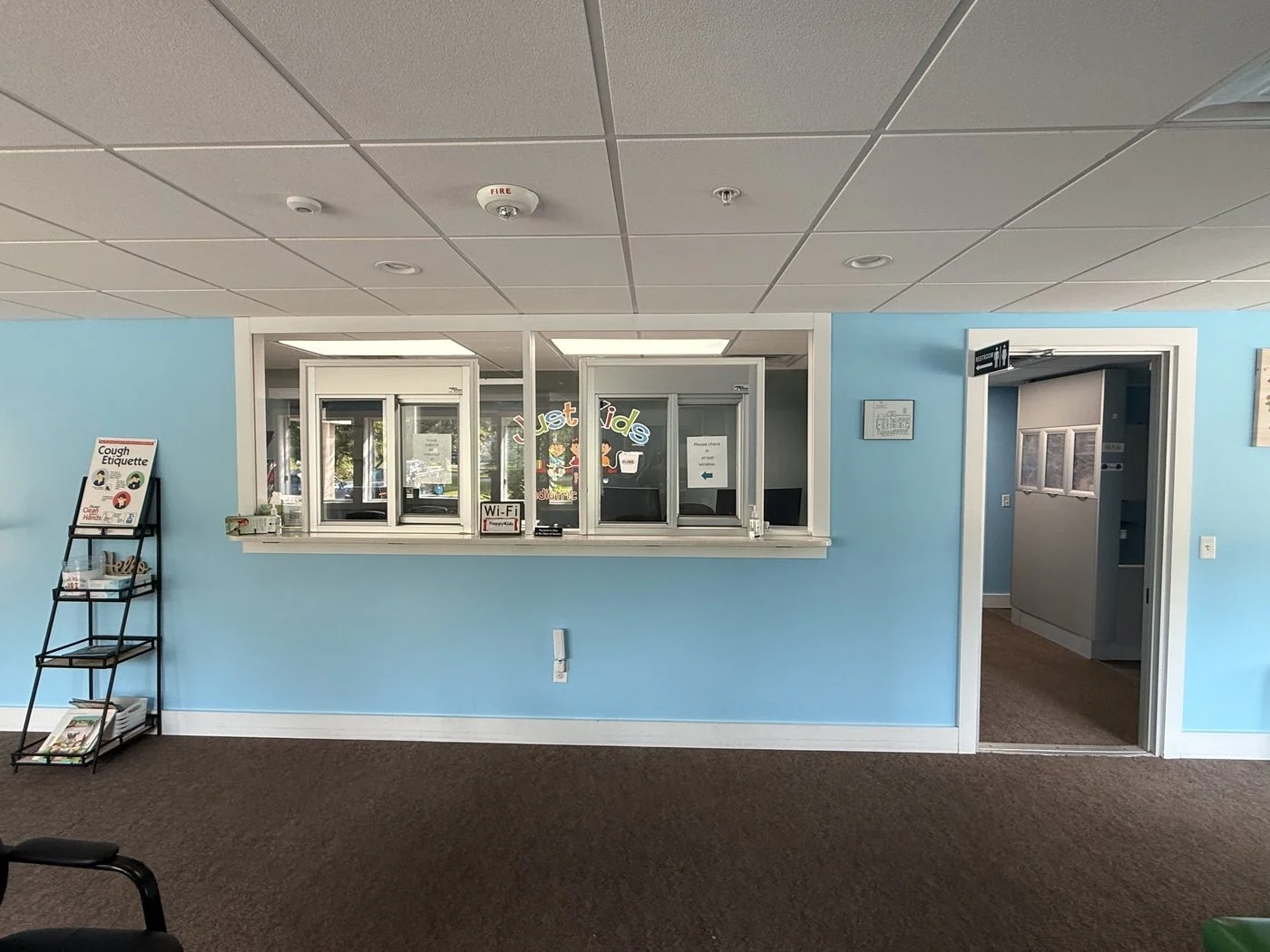 The reception and check-in window at Just Kids
