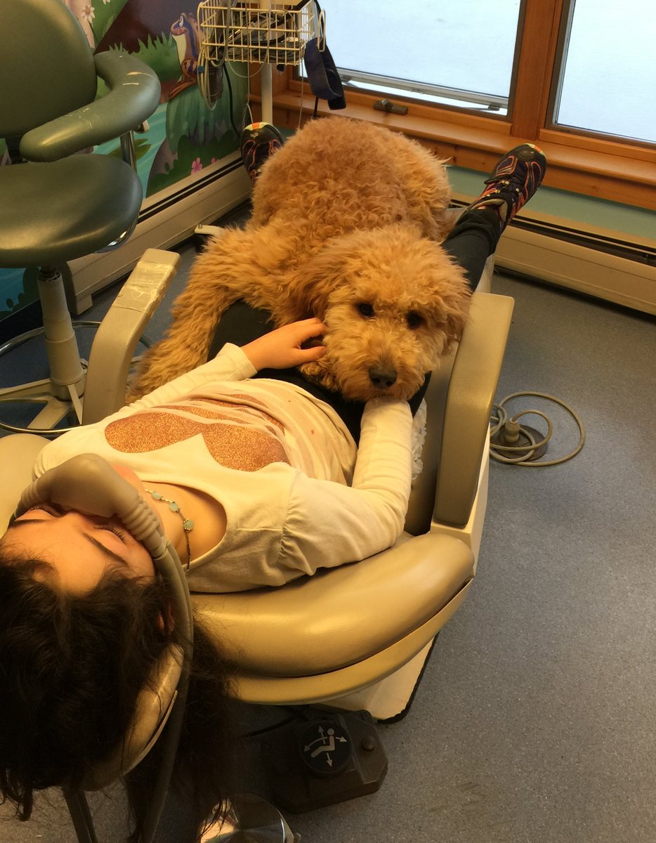 Copper lying gently on a young patient during a procedure